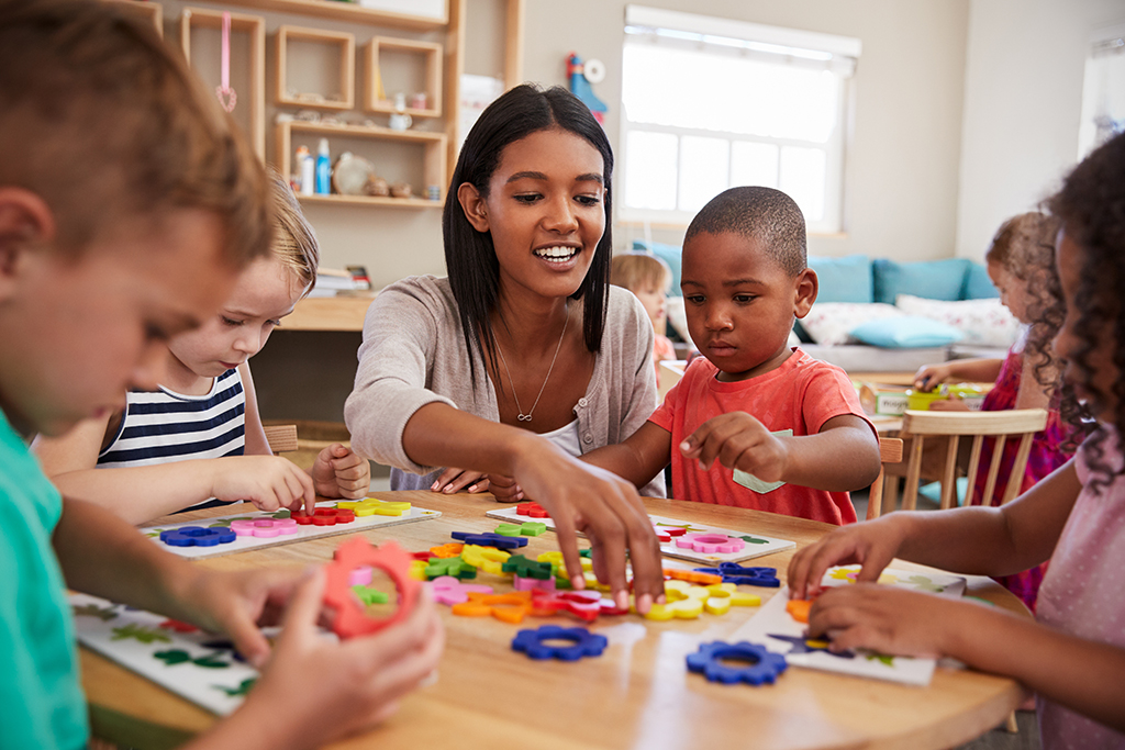 Teacher and students using flower shapes In Montessori school